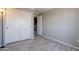 Bedroom featuring laminate wood flooring and white double door closet at 10228 E Carol Ave, Mesa, AZ 85208