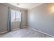 Bright bedroom featuring laminate wood flooring and view out the window at 10228 E Carol Ave, Mesa, AZ 85208