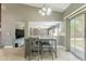 Open dining area showcasing a breakfast table with living room access at 10228 E Carol Ave, Mesa, AZ 85208