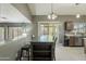 Dining area shows table with backyard access and kitchen access at 10228 E Carol Ave, Mesa, AZ 85208