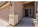 Welcoming front porch and walkway to the front door and garage at 10228 E Carol Ave, Mesa, AZ 85208