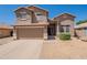Inviting two-story home with attached garage and low maintenance rock landscaping at 10228 E Carol Ave, Mesa, AZ 85208
