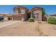 Two-story home features a well-kept yard, attached garage, and neutral-toned stucco exterior at 10228 E Carol Ave, Mesa, AZ 85208