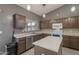 Kitchen with an island, stainless steel appliances, and natural light at 10228 E Carol Ave, Mesa, AZ 85208
