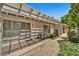 Backyard patio with gravel, artificial turf, and a shady pergola for outdoor enjoyment at 10347 W Mohawk Ln, Peoria, AZ 85382