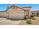 Beige one-story home featuring a well maintained front yard and a two car garage at 10347 W Mohawk Ln, Peoria, AZ 85382