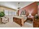 Inviting bedroom features a ceiling fan, large window, and neutral color palette at 10347 W Mohawk Ln, Peoria, AZ 85382