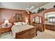 The main bedroom features a ceiling fan and an ensuite bathroom at 10347 W Mohawk Ln, Peoria, AZ 85382