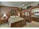 Well-appointed main bedroom features a bed, dresser, and nightstands providing ample space and storage at 10347 W Mohawk Ln, Peoria, AZ 85382