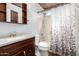 Classic bathroom with a tub and shower combination and a wooden vanity with sink at 1042 E Utopia Rd, Phoenix, AZ 85024