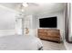 Comfortable bedroom with a queen-sized bed, a flat-screen TV, and an ensuite bathroom at 1042 E Utopia Rd, Phoenix, AZ 85024