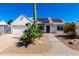 Charming single-story home featuring desert landscaping, solar panels, and a two-car garage at 1042 E Utopia Rd, Phoenix, AZ 85024