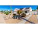 Attractive single-story home boasting desert landscaping, solar panels, and a well-maintained yard at 1042 E Utopia Rd, Phoenix, AZ 85024