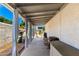 Covered patio with white curtains for shade and privacy, perfect for outdoor relaxation and entertaining at 1042 E Utopia Rd, Phoenix, AZ 85024