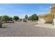Backyard with fountain, gravel, and an attached patio at 1051 S 81St Way, Mesa, AZ 85208