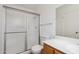 This bathroom features a sliding door shower, toilet, sink, and mirror at 1051 S 81St Way, Mesa, AZ 85208