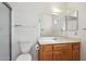 Bathroom featuring a toilet, mirror, vanity with sink, and a shower at 1051 S 81St Way, Mesa, AZ 85208