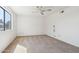 Bright bedroom featuring neutral carpet, ceiling fan, and ample natural light at 1051 S 81St Way, Mesa, AZ 85208