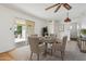 Dining room features a round table, chairs, and a sliding glass door to the patio at 1051 S 81St Way, Mesa, AZ 85208