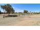 Community dog park with fencing, trees, and shady areas for dogs and owners at 1051 S 81St Way, Mesa, AZ 85208