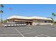 Exterior view of the Banister of the Sun Country Club with multiple golf carts parked outside at 1051 S 81St Way, Mesa, AZ 85208