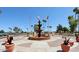 Community fountain featuring landscaped grounds and various state and national flags at 1051 S 81St Way, Mesa, AZ 85208
