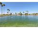 Scenic lake view showcasing calm waters and surrounding community landscaping at 1051 S 81St Way, Mesa, AZ 85208
