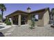 Exterior of home featuring a covered patio and xeriscaping at 1123 E Shepherds Way, Casa Grande, AZ 85122