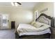 Bright bedroom with carpet flooring, and door that leads to the outdoors at 1123 E Shepherds Way, Casa Grande, AZ 85122
