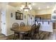 Inviting dining space with hardwood floors, chandelier, and easy access to kitchen area at 1123 E Shepherds Way, Casa Grande, AZ 85122