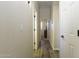 Bright hallway with wood floors leads to bedrooms in this modern home at 1123 E Shepherds Way, Casa Grande, AZ 85122