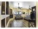 Cozy living room boasts hardwood floors, a fireplace, ceiling fans, and comfortable seating at 1123 E Shepherds Way, Casa Grande, AZ 85122