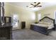 Primary bedroom featuring carpet flooring, ensuite access, with a door that leads outside at 1123 E Shepherds Way, Casa Grande, AZ 85122