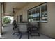 Covered patio with ceiling fan and seating at 1123 E Shepherds Way, Casa Grande, AZ 85122
