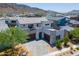 Aerial view of an impressive modern home with mountain views in a desirable neighborhood at 1221 E Paseo Way, Phoenix, AZ 85042