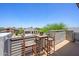 A cozy balcony with outdoor seating, offering a peaceful view of the neighborhood at 1221 E Paseo Way, Phoenix, AZ 85042