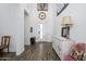 Inviting home entrance featuring light-filled space, wood floors, and decorative accents at 1221 E Paseo Way, Phoenix, AZ 85042