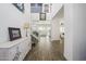 Bright, open foyer with soaring ceilings, elegant staircase, and wood-look tile flooring at 1221 E Paseo Way, Phoenix, AZ 85042