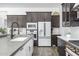 Well-equipped kitchen featuring stainless steel appliances, a spacious sink, and sleek countertops at 1221 E Paseo Way, Phoenix, AZ 85042