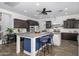 A spacious kitchen with an oversized island, stainless steel appliances and hardwood floors at 1221 E Paseo Way, Phoenix, AZ 85042
