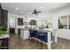 Bright kitchen featuring a large island, stylish barstools, and wood-look tile flooring at 1221 E Paseo Way, Phoenix, AZ 85042