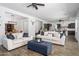 Spacious living room connects dining area and kitchen, featuring hard surface floors and light neutral paint at 1221 E Paseo Way, Phoenix, AZ 85042