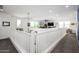 Open loft area with bright lighting and neutral carpet, perfect for a seating or office space at 1221 E Paseo Way, Phoenix, AZ 85042