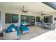 Inviting outdoor patio featuring comfortable seating and a view of the sparkling swimming pool at 1221 E Paseo Way, Phoenix, AZ 85042