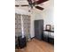 Bedroom with hardwood floors, storage wardrobe and rolling storage bins at 1222 E Almeria Rd, Phoenix, AZ 85006