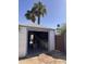 Exterior of garage with open door, desert landscaping and sunny skies at 1222 E Almeria Rd, Phoenix, AZ 85006
