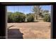 View from garage out to backyard, playground, and desert landscaping at 1222 E Almeria Rd, Phoenix, AZ 85006