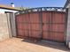 Attractive wood and wrought iron gate providing security and curb appeal at 1222 E Almeria Rd, Phoenix, AZ 85006