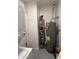 Functional laundry area with washer, dryer, storage cabinet and water heater at 1222 E Almeria Rd, Phoenix, AZ 85006