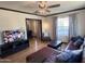 Spacious living room with hardwood floors, entertainment center, and ample natural light at 1222 E Almeria Rd, Phoenix, AZ 85006